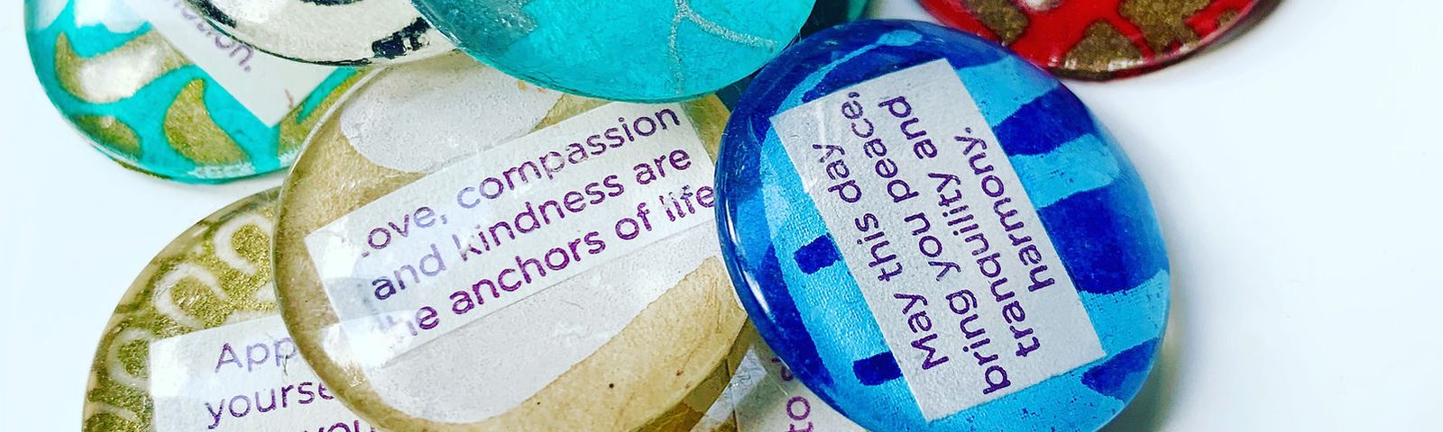 Hand-made badges with written affirmations such as love, compassion and kindness are the anchors of life